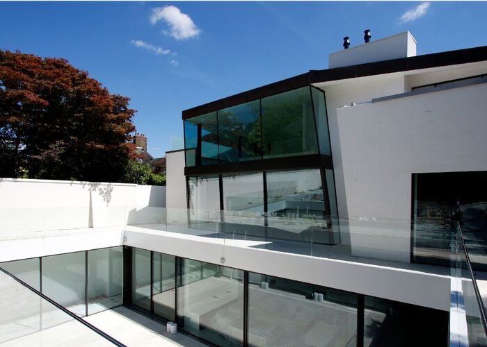 thedesignsociety feature IQ Glass slim framed sliding glass doors in Hampstead House